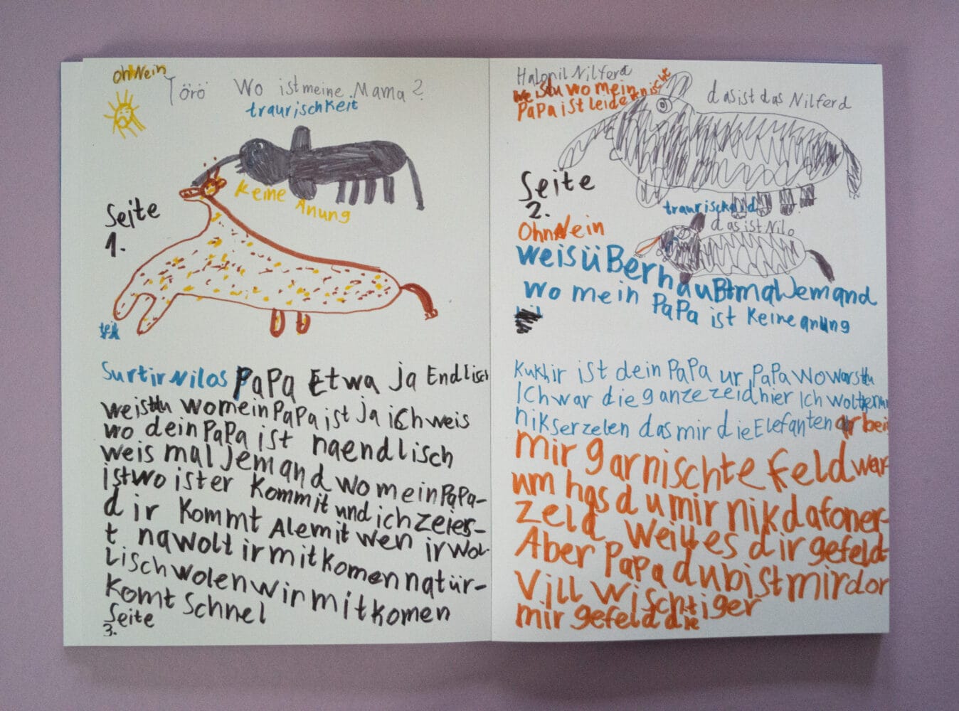 Innenseiten des Buches die Texte und Kinderzeichnungen zeigen